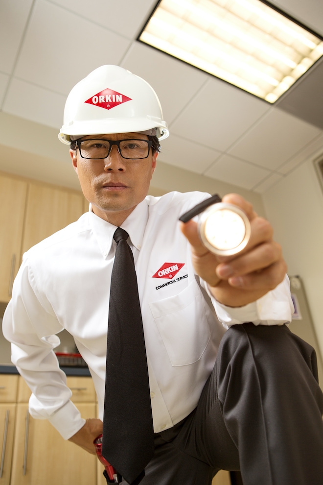 Orkin commercial Pro inspecting customer facility