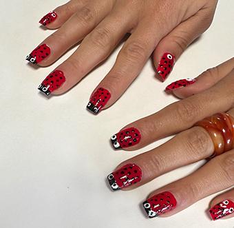 lady bug images painted on finger nails