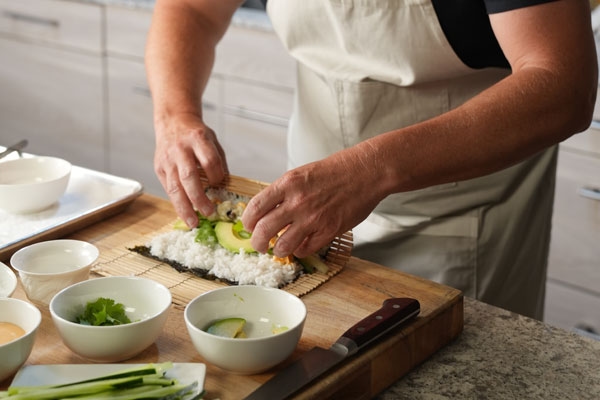 Bug Bites - Chef Richard Blais rolling soft shell tarantula sushi roll