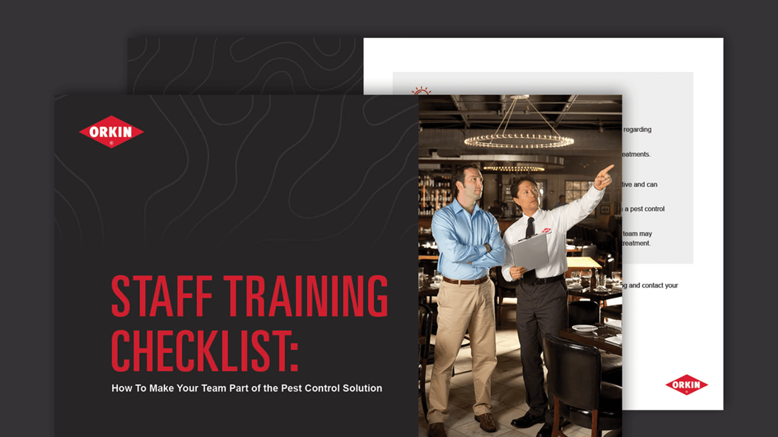 Orkin Commercial Pro going through a checklist with a restaurant manager, pointing out areas of concern for pest prevention.