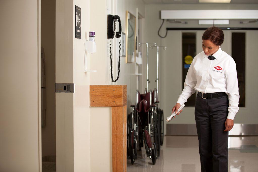 Orkin Pro Inspecting Hospital Hallway