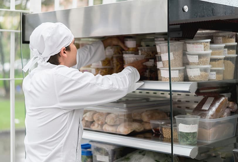 Chef Stocking Food Shelf
