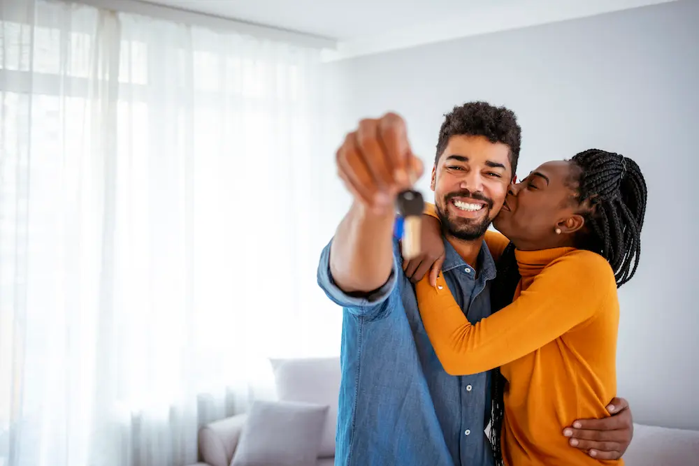Couple with new home keys