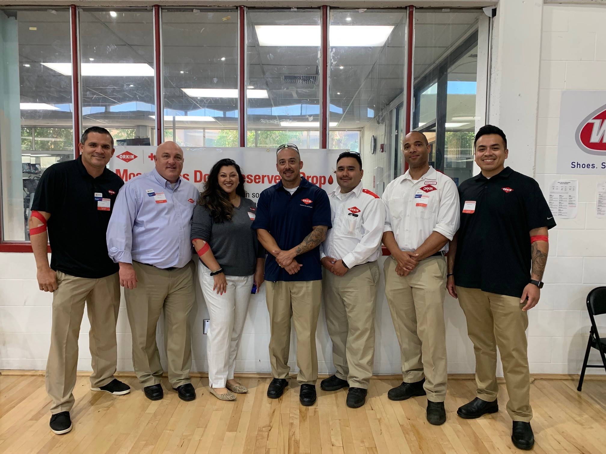 Orkin Pros posing for a photo after donating blood as part of Orkin's 2022 Los Angeles blood drive.
